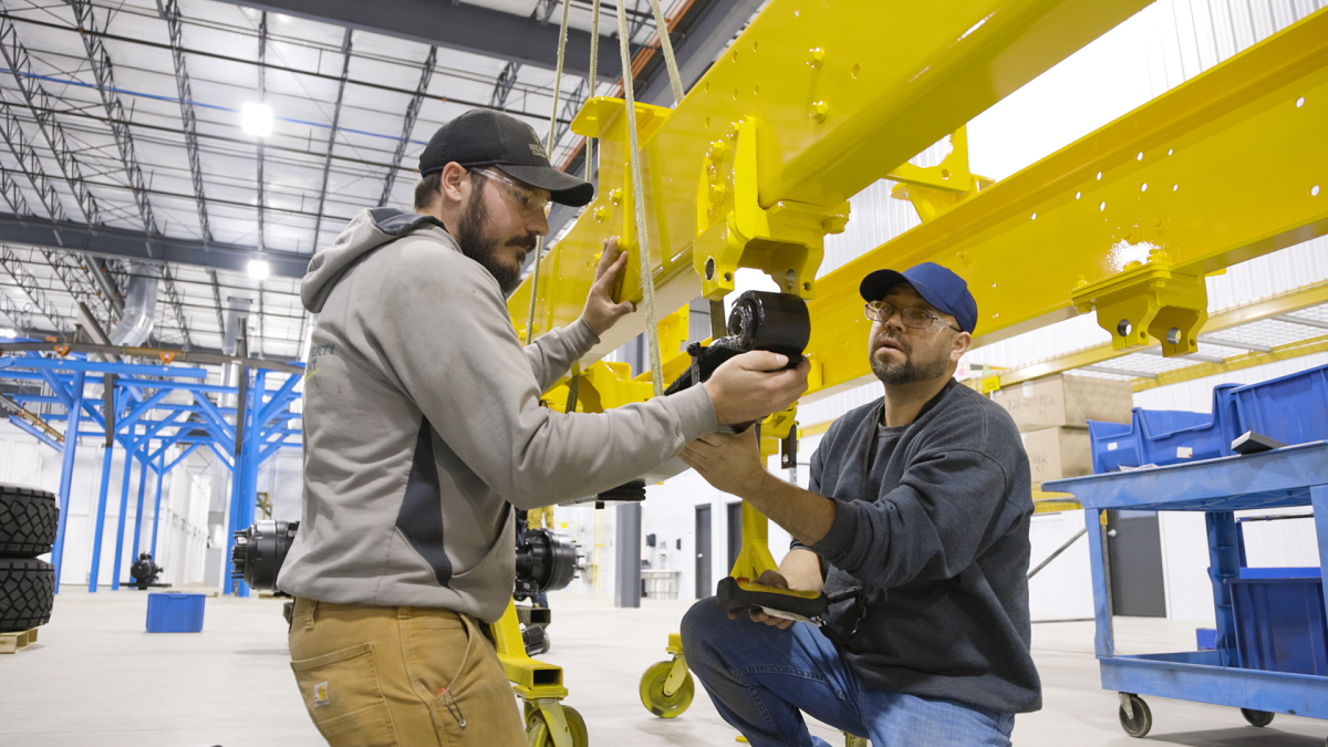 Men working on yellow beams