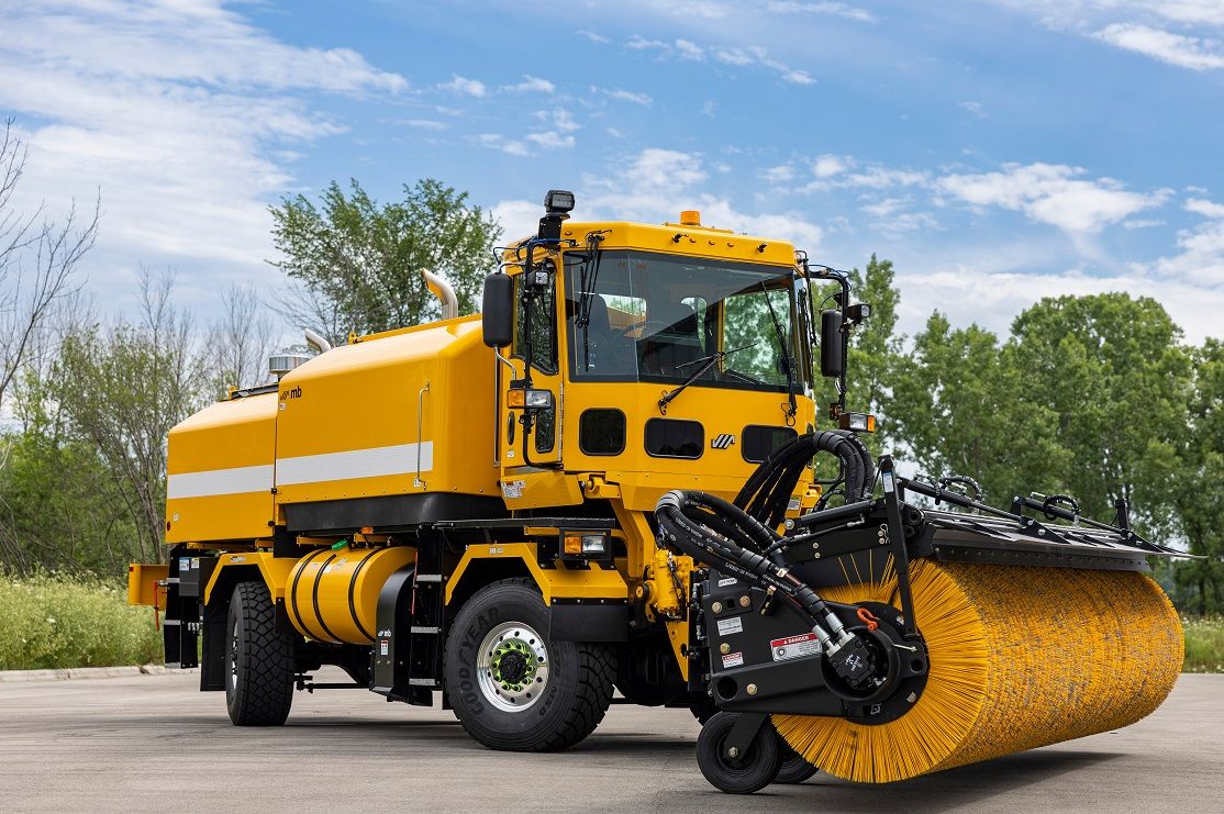 Yellow truck with M-B maintenance equipment attached